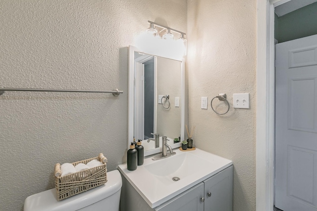 5909 Eisenhower Dr, Fort Worth, TX 76112 - bathroom featuring vanity and a textured wall
