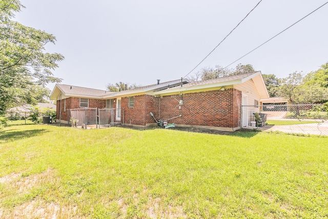 5909 Eisenhower Dr, Fort Worth, TX 76112 - back of property featuring brick siding and a gate