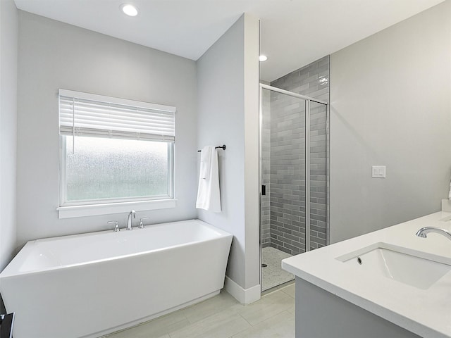 403 Sonoma Ct, Sherman, TX 75092 - full bath featuring a freestanding bath, a stall shower, double vanity, recessed lighting, and tile patterned flooring