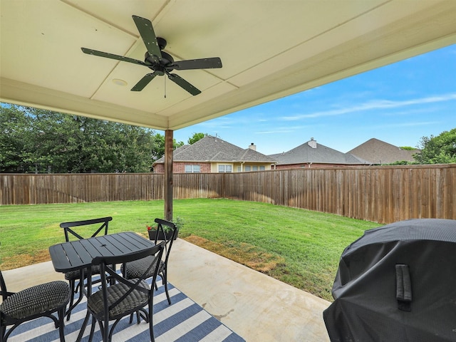 403 Sonoma Ct, Sherman, TX 75092 - fenced backyard featuring grilling area, a patio area, a ceiling fan, and outdoor dining area