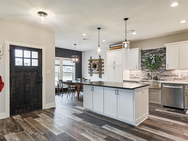 403 Sonoma Ct, Sherman, TX 75092 - kitchen with dishwasher, backsplash, a kitchen island, recessed lighting, and dark wood-type flooring