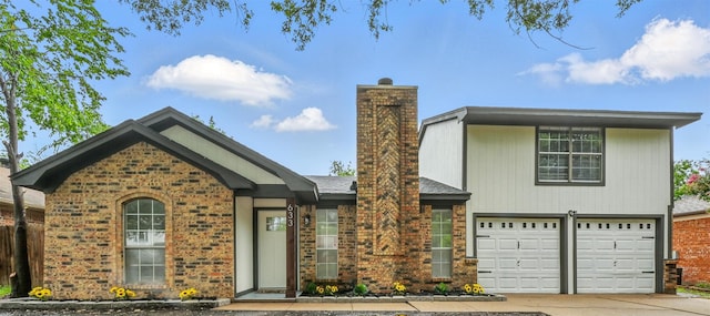 633 S Waxahachie St, Mansfield, TX 76063 - view of front facade featuring a chimney, concrete driveway, brick siding, and a garage