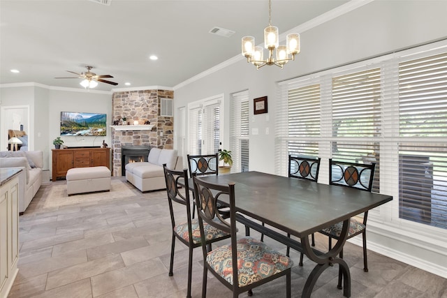 2104 Turtlecreek, Denison, TX 75020 - dining room with a fireplace, ornamental molding, a chandelier, ceiling fan, and recessed lighting