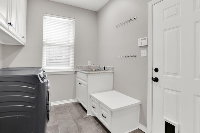 2104 Turtlecreek, Denison, TX 75020 - laundry room featuring separate washer and dryer and cabinet space