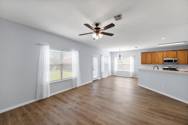 1205 Bonnet Dr, Fort Worth, TX 76131 - unfurnished living room with wood finished floors and a ceiling fan