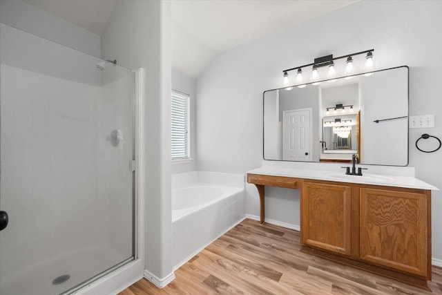 1205 Bonnet Dr, Fort Worth, TX 76131 - full bath with a stall shower, a bath, wood finished floors, vanity, and vaulted ceiling