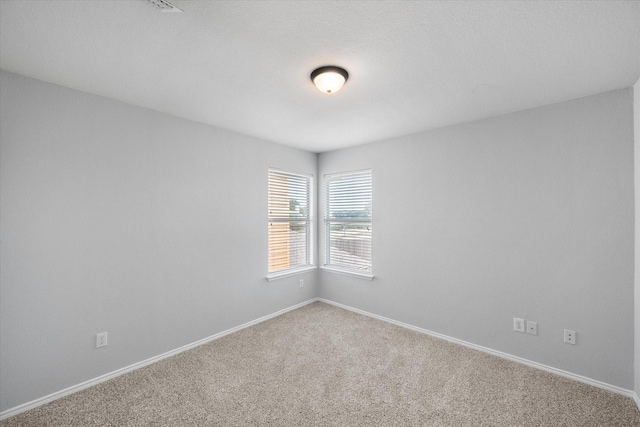 1205 Bonnet Dr, Fort Worth, TX 76131 - carpeted spare room featuring baseboards
