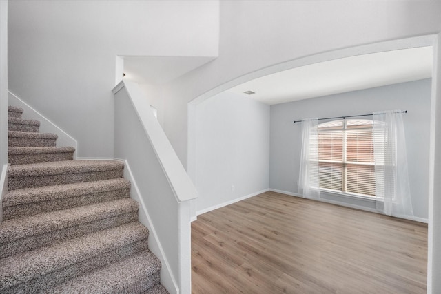1205 Bonnet Dr, Fort Worth, TX 76131 - stairway featuring wood finished floors and arched walkways