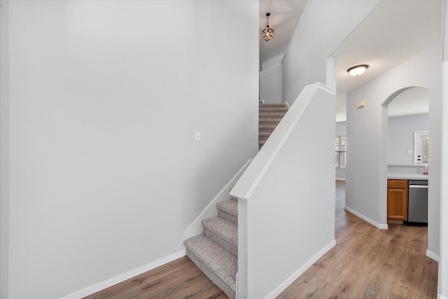 1205 Bonnet Dr, Fort Worth, TX 76131 - staircase with wood finished floors and arched walkways