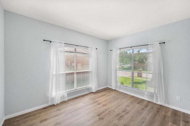 1205 Bonnet Dr, Fort Worth, TX 76131 - spare room with wood finished floors and baseboards
