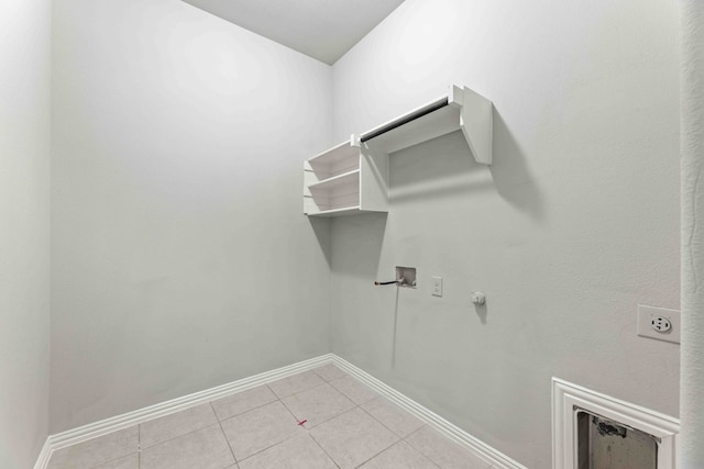 1033 Water Garden Cir, Little Elm, TX 75068 - laundry room featuring gas dryer hookup, washer hookup, light tile patterned floors, and hookup for an electric dryer