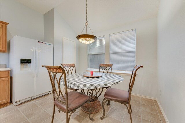 104 Singleton Dr, Royse City, TX 75189 - dining area with lofted ceiling and light tile patterned floors