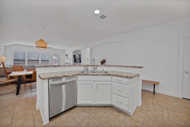 4517 Evanshire Way, Mckinney, TX 75070 - kitchen with dishwasher, arched walkways, light tile patterned flooring, light stone counters, and white cabinetry