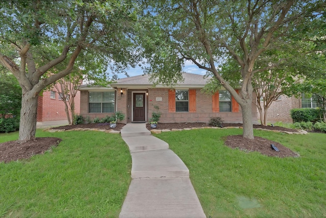 4517 Evanshire Way, Mckinney, TX 75070 - view of front of property with brick siding and a front yard