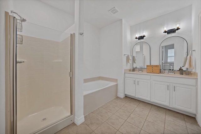 4517 Evanshire Way, Mckinney, TX 75070 - full bath featuring a garden tub, double vanity, a stall shower, and tile patterned floors