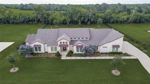 2110 Honey Ln, Celina, TX 75009 - view of front of property featuring a front lawn, concrete driveway, a standing seam roof, and stone siding