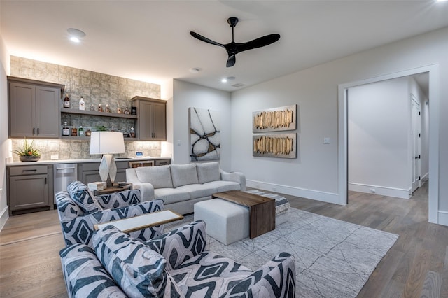2110 Honey Ln, Celina, TX 75009 - living area featuring ceiling fan, light wood finished floors, bar with sink, and recessed lighting