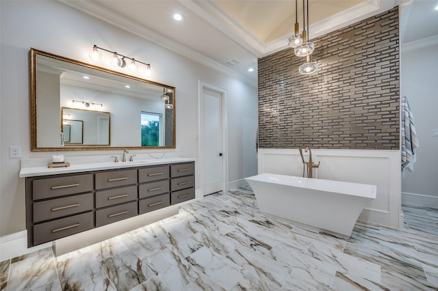 2110 Honey Ln, Celina, TX 75009 - bathroom featuring an accent wall, ornamental molding, vanity, a freestanding bath, and recessed lighting