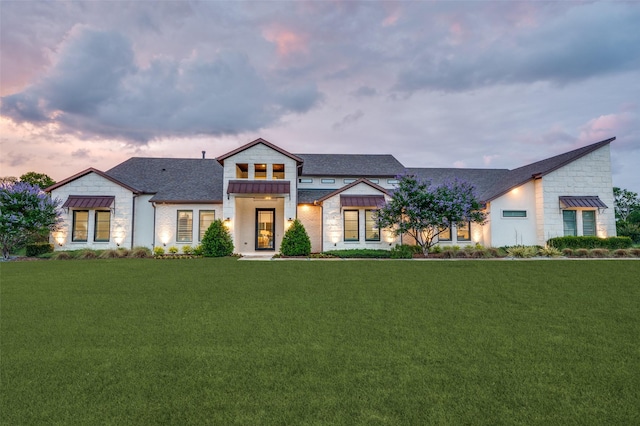 2110 Honey Ln, Celina, TX 75009 - view of front of house with stone siding, a standing seam roof, a lawn, and roof with shingles