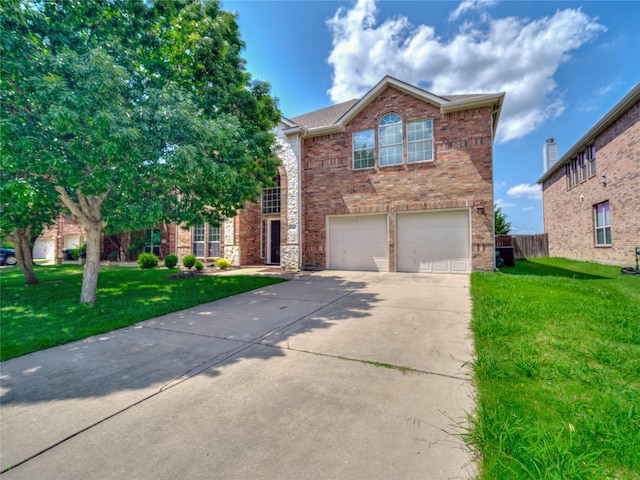 1034 Pelican Dr, Frisco, TX 75033 - view of front of property featuring concrete driveway, an attached garage, and brick siding