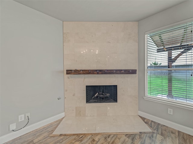 1034 Pelican Dr, Frisco, TX 75033 - detailed view of wood finished floors and a tiled fireplace