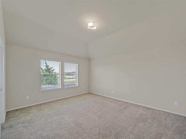 1034 Pelican Dr, Frisco, TX 75033 - empty room featuring light colored carpet and lofted ceiling