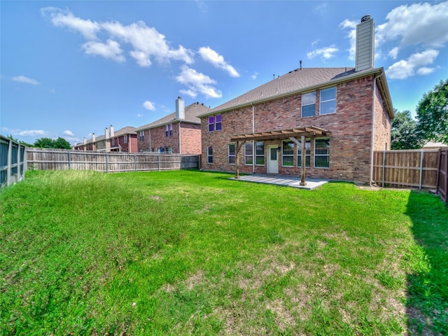 1034 Pelican Dr, Frisco, TX 75033 - back of property featuring a chimney, brick siding, a fenced backyard, and a patio