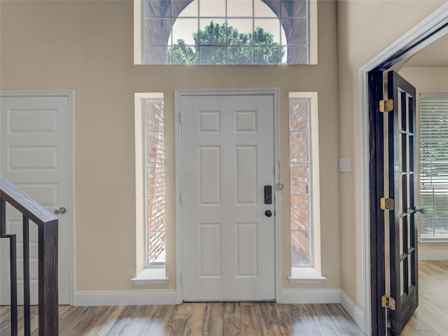 1034 Pelican Dr, Frisco, TX 75033 - entryway featuring wood finished floors and a high ceiling