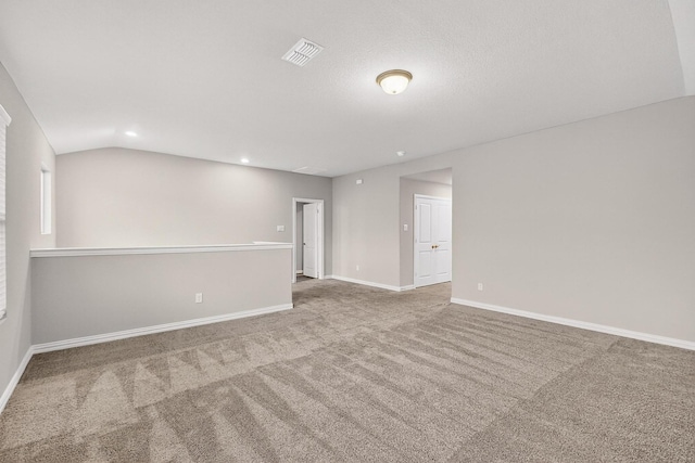 333 Edmund Ln, Fate, TX 75087 - empty room featuring carpet floors, lofted ceiling, and recessed lighting