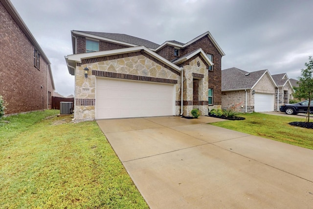 333 Edmund Ln, Fate, TX 75087 - view of front of home featuring stone siding, a front lawn, an attached garage, and brick siding