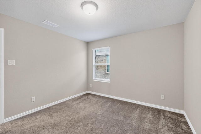 333 Edmund Ln, Fate, TX 75087 - carpeted spare room with a textured ceiling