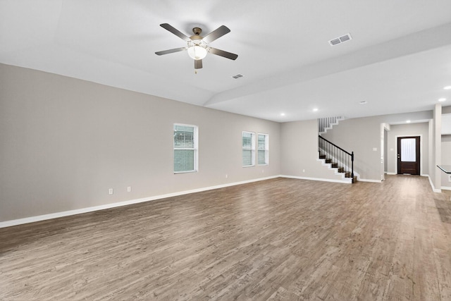 333 Edmund Ln, Fate, TX 75087 - unfurnished living room with wood finished floors, stairs, ceiling fan, and recessed lighting