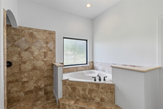 805 S Duncan Creek Ct, Weatherford, TX 76087 - bathroom featuring a garden tub and a tile shower