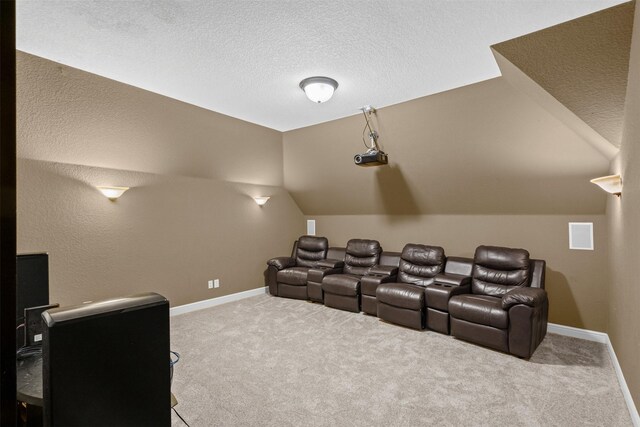 805 S Duncan Creek Ct, Weatherford, TX 76087 - carpeted home theater room with vaulted ceiling and a textured ceiling