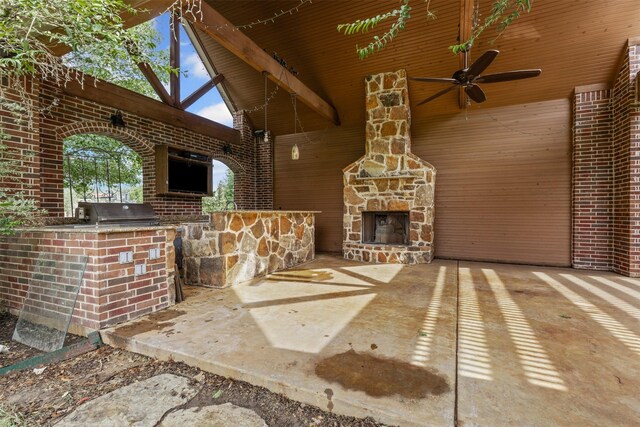805 S Duncan Creek Ct, Weatherford, TX 76087 - view of patio / terrace with exterior kitchen, an outdoor stone fireplace, and ceiling fan