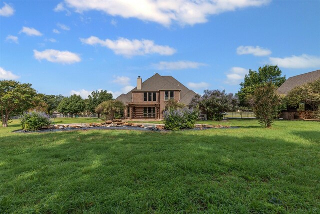 805 S Duncan Creek Ct, Weatherford, TX 76087 - back of house with a chimney and a lawn