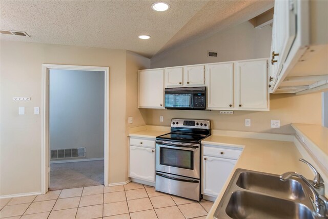 1021 Summertree Cir, Plano, TX 75025 - kitchen featuring black microwave, stainless steel range with electric stovetop, a textured ceiling, white cabinets, and recessed lighting
