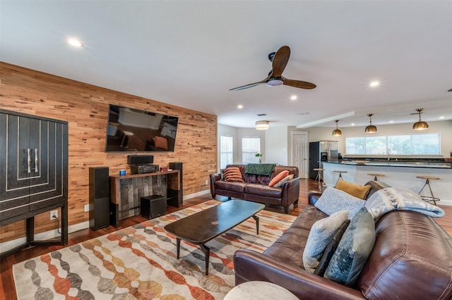 6318 White Oaks Ln, Frisco, TX 75035 - living area with wood walls, recessed lighting, ceiling fan, and wood finished floors