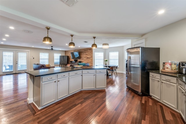 6318 White Oaks Ln, Frisco, TX 75035 - kitchen with stainless steel fridge with ice dispenser, open floor plan, dark wood-type flooring, a center island, and recessed lighting