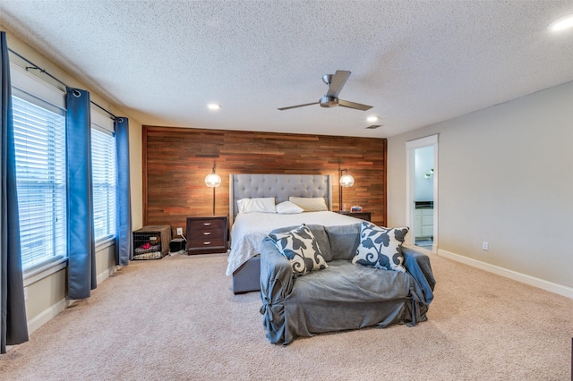 6318 White Oaks Ln, Frisco, TX 75035 - bedroom featuring wood walls, a textured ceiling, carpet floors, an accent wall, and recessed lighting