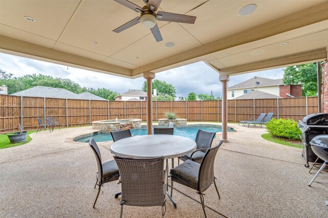 6318 White Oaks Ln, Frisco, TX 75035 - fenced backyard with a ceiling fan, a patio area, and a pool with connected hot tub