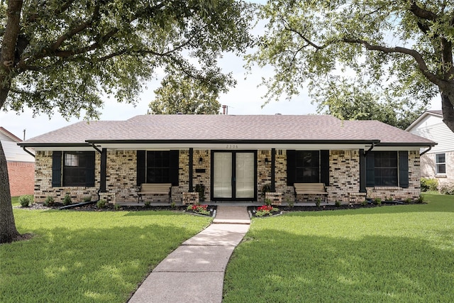 2306 Apollo Way, Mesquite, TX 75150 - single story home featuring a front lawn, brick siding, and roof with shingles