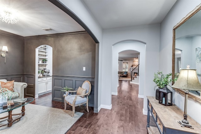 759 Bancroft Rd, Keller, TX 76248 - interior space with dark wood-type flooring, a decorative wall, stairs, arched walkways, and wainscoting