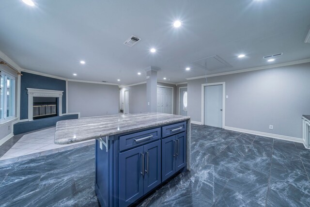 1825 Emerald Dr, Irving, TX 75060 - kitchen with open floor plan, crown molding, recessed lighting, a kitchen island, and blue cabinetry