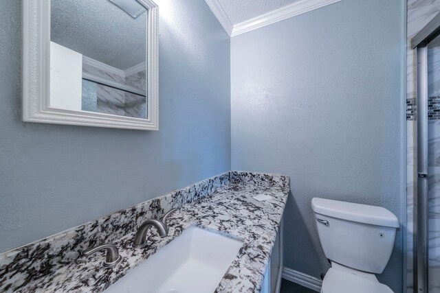 1825 Emerald Dr, Irving, TX 75060 - full bathroom with crown molding, vanity, and a textured ceiling