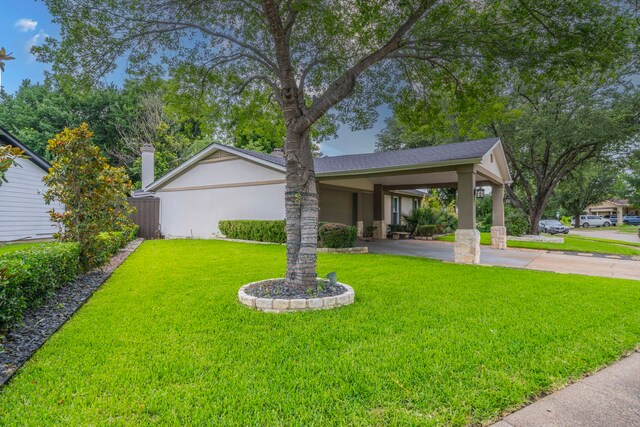 1825 Emerald Dr, Irving, TX 75060 - view of yard featuring concrete driveway and an attached carport