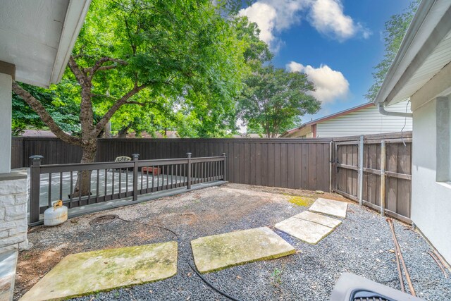 1825 Emerald Dr, Irving, TX 75060 - fenced backyard featuring a gate and a patio