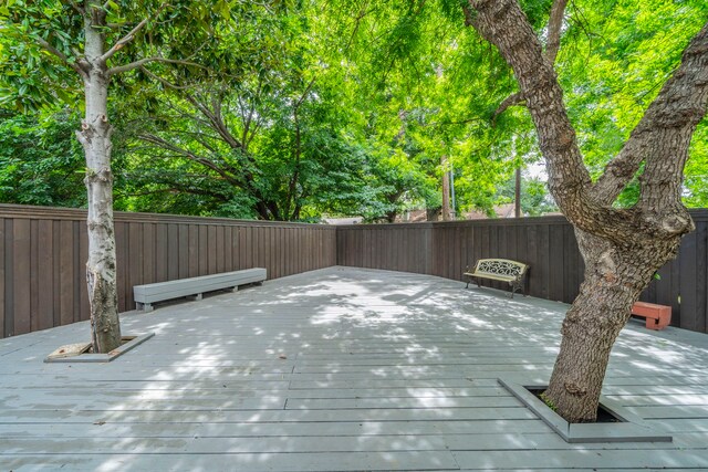 1825 Emerald Dr, Irving, TX 75060 - wooden terrace with a fenced backyard