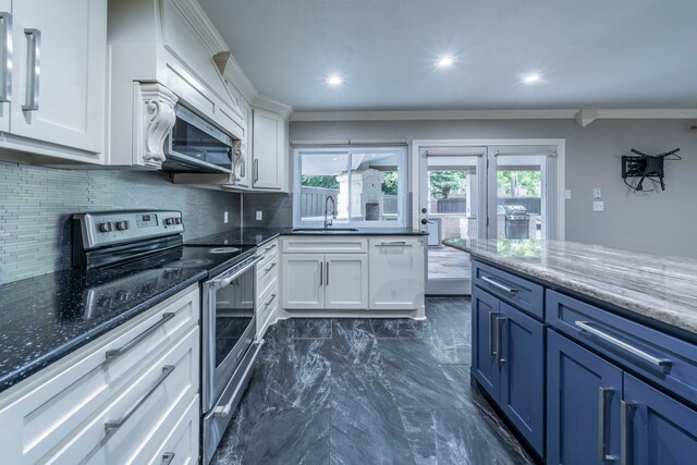 1825 Emerald Dr, Irving, TX 75060 - kitchen featuring appliances with stainless steel finishes, decorative backsplash, white cabinets, plenty of natural light, and ornamental molding