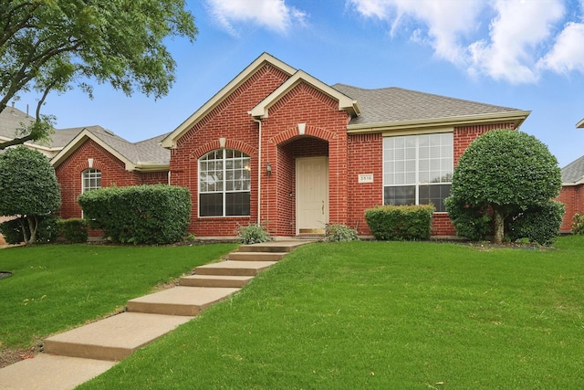 3516 San Patricio Dr, Plano, TX 75025 - view of front facade with brick siding, a front lawn, and roof with shingles
